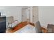 Bright bedroom with wood floors, neutral walls, with an adjacent open door at 2114 Thurmond Pl, Charlotte, NC 28205