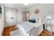 Cozy bedroom with a plush bed, hardwood floors, and stylish decor at 2114 Thurmond Pl, Charlotte, NC 28205