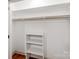 Well-organized walk-in closet with white shelving and ample storage space for clothes at 2114 Thurmond Pl, Charlotte, NC 28205