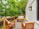 Relax on the wooden deck furnished with stylish seating at 2114 Thurmond Pl, Charlotte, NC 28205