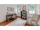 Bright home office space with modern desk, decor, shelving, and natural light at 2114 Thurmond Pl, Charlotte, NC 28205