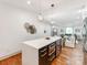 Open concept kitchen with stainless appliances and views into the living room at 2114 Thurmond Pl, Charlotte, NC 28205