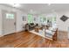 Bright living room with large windows, modern furniture, and hardwood floors, offering a stylish and comfortable living space at 2114 Thurmond Pl, Charlotte, NC 28205