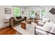 Comfortable living room with a large sofa, ample natural light, and a cozy atmosphere at 2114 Thurmond Pl, Charlotte, NC 28205
