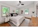 Comfortable main bedroom featuring hardwood floors, a ceiling fan, and great natural light at 2114 Thurmond Pl, Charlotte, NC 28205