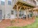 Home's backyard with grill, covered patio, and grassy area at 2169 Belle Vernon Ave, Charlotte, NC 28210