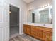 Bathroom featuring a double sink vanity and a doorway leading into a bedroom at 2169 Belle Vernon Ave, Charlotte, NC 28210