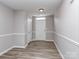 Inviting entryway features neutral walls, a white door, and durable wood-look flooring at 2169 Belle Vernon Ave, Charlotte, NC 28210