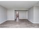 Bright living area with wood-look floors, neutral walls, and multiple doorways for easy access at 2169 Belle Vernon Ave, Charlotte, NC 28210