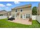 Backyard with a spacious patio, built-in grill, and lush green lawn, perfect for outdoor gatherings and relaxation at 2233 Sonoma Valley Dr, Charlotte, NC 28214
