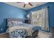 Stylish blue bedroom featuring a comfortable bed, window with blinds, and neutral accents at 2233 Sonoma Valley Dr, Charlotte, NC 28214