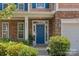 Close-up of the front door, showcasing stone details, landscaping, and a welcoming entrance at 2233 Sonoma Valley Dr, Charlotte, NC 28214