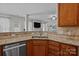 The kitchen has granite counters, stainless sink and decorative tile backsplash at 2233 Sonoma Valley Dr, Charlotte, NC 28214