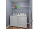 Functional laundry room with modern washer and dryer units and storage solutions at 2233 Sonoma Valley Dr, Charlotte, NC 28214