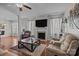 Open-concept living room with hardwood floors, plush sofas, fireplace and mounted television at 2233 Sonoma Valley Dr, Charlotte, NC 28214
