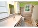 Bathroom features a white sink, modern faucet, and wood paneled walls at 2625 Glenn St, Newton, NC 28658