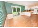 Bright kitchen with light wood floors, white cabinets, and sliding glass doors to the backyard at 2625 Glenn St, Newton, NC 28658
