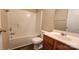 This bathroom features a bath and shower, single vanity, and toilet at 3208 Barons Court Rd, Charlotte, NC 28213