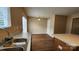 Open kitchen layout featuring a kitchen island, dining area, hardwood floors and ample counter space at 3208 Barons Court Rd, Charlotte, NC 28213