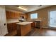 Bright kitchen with stainless steel appliances, an island, and ample cabinet space at 3208 Barons Court Rd, Charlotte, NC 28213