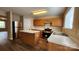 Updated kitchen with stainless steel appliances, spacious countertops, an island, and hardwood floors at 3208 Barons Court Rd, Charlotte, NC 28213