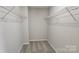 Empty walk-in closet featuring carpeted floors and wire shelving at 3208 Barons Court Rd, Charlotte, NC 28213