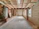 Large unfinished basement features block walls, exposed ceiling, and a water heater at 322 Peachtree St, Albemarle, NC 28001
