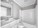Bathroom with white tile, shower/tub combo, and white vanity at 322 Peachtree St, Albemarle, NC 28001