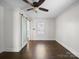 Bedroom featuring dark wood floors and ceiling fan at 322 Peachtree St, Albemarle, NC 28001