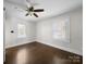 Bedroom featuring dark wood floors and natural light from window at 322 Peachtree St, Albemarle, NC 28001