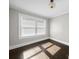 Bedroom featuring dark wood floors and natural light from window at 322 Peachtree St, Albemarle, NC 28001