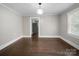 Spacious dining area features hardwood floors and ample natural light at 322 Peachtree St, Albemarle, NC 28001