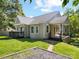 Charming house with neutral siding, inviting porch, and well-maintained lawn on a sunny day at 322 Peachtree St, Albemarle, NC 28001