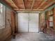 Spacious garage with concrete floor and wood ceiling, offering ample storage or parking space at 322 Peachtree St, Albemarle, NC 28001