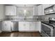 Stylish kitchen features white cabinets, granite countertops, and stainless steel appliances at 322 Peachtree St, Albemarle, NC 28001