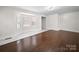Bright living room with gleaming hardwood floors and bay window at 322 Peachtree St, Albemarle, NC 28001