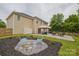 Spacious backyard with landscaped flowerbeds, covered area, and green grass at 4001 Brook Valley Run, Monroe, NC 28110