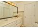 Bathroom with a double sink vanity, large mirror and accent wall with geometric wallpaper at 4001 Brook Valley Run, Monroe, NC 28110
