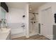 Bright bathroom featuring tub and shower with white subway tile and a modern vanity with a mirror at 4001 Brook Valley Run, Monroe, NC 28110