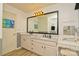 Bright bathroom featuring double sinks, large mirror, tile backsplash and ample countertop space at 4001 Brook Valley Run, Monroe, NC 28110