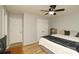 Bedroom with light gray walls, wood floors, ceiling fan, and white trim at 4001 Brook Valley Run, Monroe, NC 28110