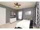 Bedroom with neutral walls, carpet floors, a ceiling fan, and window letting in natural light at 4001 Brook Valley Run, Monroe, NC 28110
