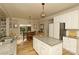 Bright kitchen with an island, stainless steel appliances, and a breakfast nook area that opens to the backyard at 4001 Brook Valley Run, Monroe, NC 28110
