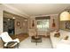 Inviting living room with neutral decor, hardwood floors, comfortable seating and a view to an adjacent office space at 4001 Brook Valley Run, Monroe, NC 28110