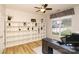 Bright office with a ceiling fan, large shelving unit, and a large window that offers plenty of natural light at 4001 Brook Valley Run, Monroe, NC 28110