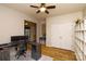 Spacious office area with wood floors, dual monitors, and a closet for plenty of storage at 4001 Brook Valley Run, Monroe, NC 28110