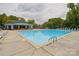 Community pool with lounge chairs and a covered picnic area at 4001 Brook Valley Run, Monroe, NC 28110