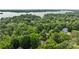 Stunning aerial view of a home nestled in a lush, wooded neighborhood near the lake at 4043 Windward Dr, Fort Mill, SC 29708