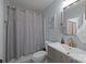 Bathroom featuring modern vanity, shower with curtain, and updated fixtures, providing a comfortable and stylish space at 4043 Windward Dr, Fort Mill, SC 29708