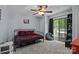 This cozy bedroom includes a unique bed frame, adjacent access to a private deck, and ample natural lighting at 4043 Windward Dr, Fort Mill, SC 29708